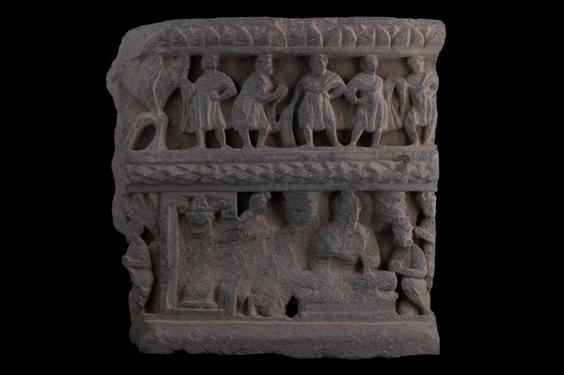 Image of Buddha and devotees; male figures